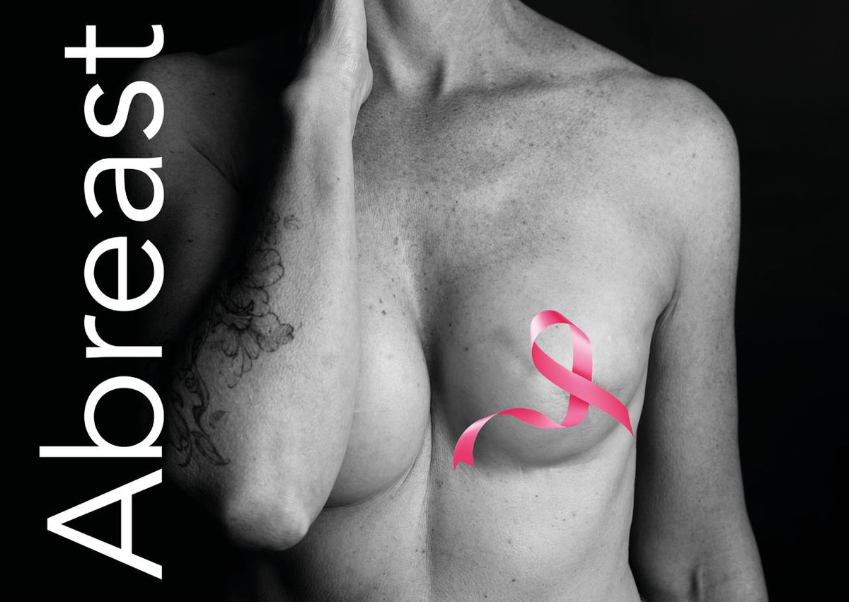 Promotional image for Abreast, a group exhibition at Tinker Gallery Ilkley supporting Breast Cancer Awareness Month, showing a black and white photograph of a female torso with a pink ribbon. Image credit Lumiere Photographic.