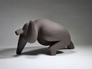 Abstract ceramic woman sculpture on a grey background