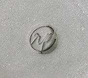 Circular logo stamp on grey clay
