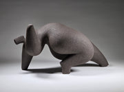 Abstract ceramic woman sculpture on a grey background