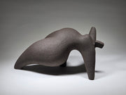 Abstract ceramic woman sculpture on a grey background