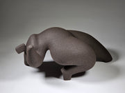 Abstract ceramic woman sculpture on a grey background
