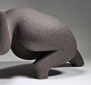 Close up of abstract ceramic woman sculpture on a grey background