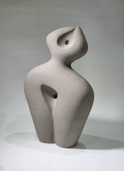 Abstract ceramic sculpture on a grey background