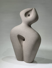 Abstract ceramic sculpture on a grey background