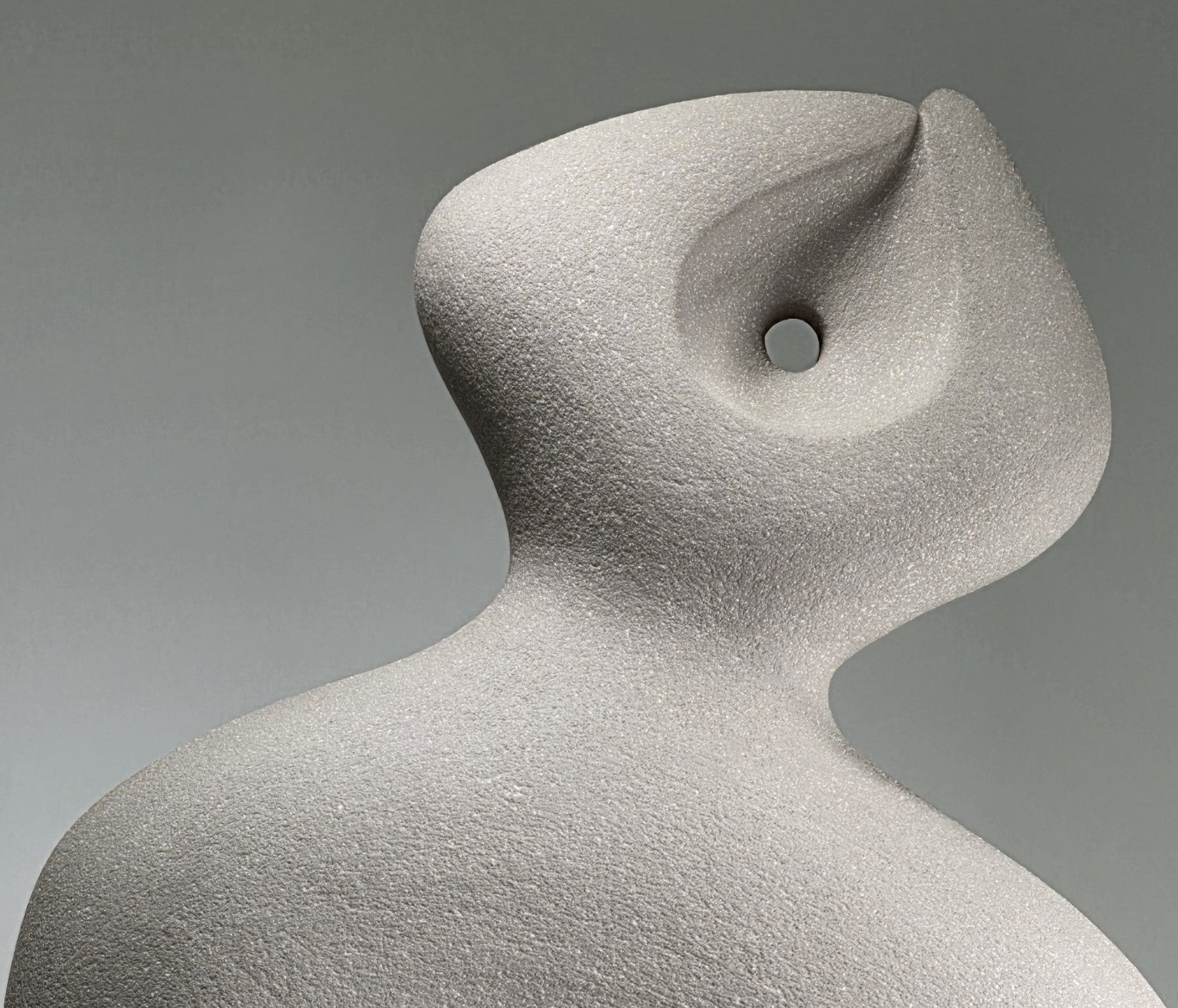 Close up of Abstract ceramic sculpture on a grey background