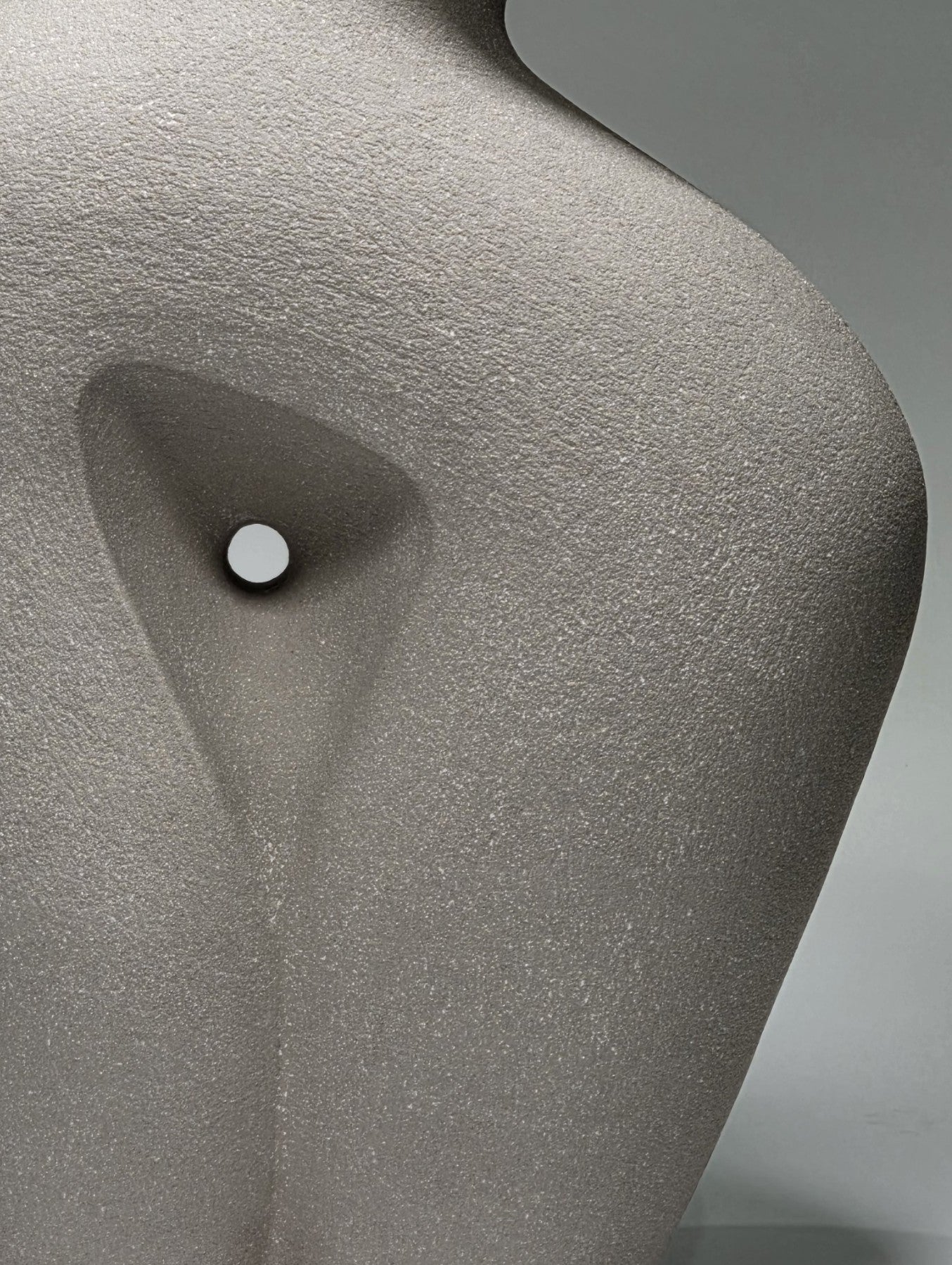 Close up of Abstract ceramic sculpture on a gray background
