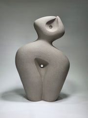 Abstract ceramic sculpture on a grey background