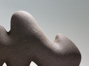 Close up of Pulse ceramic sculpture, hand-built stoneware, rhythmic wave-like form, horizontal composition