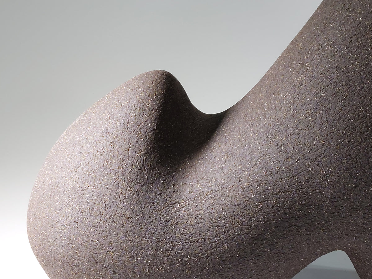 Close up of Pulse ceramic sculpture, hand-built stoneware, rhythmic wave-like form, horizontal composition